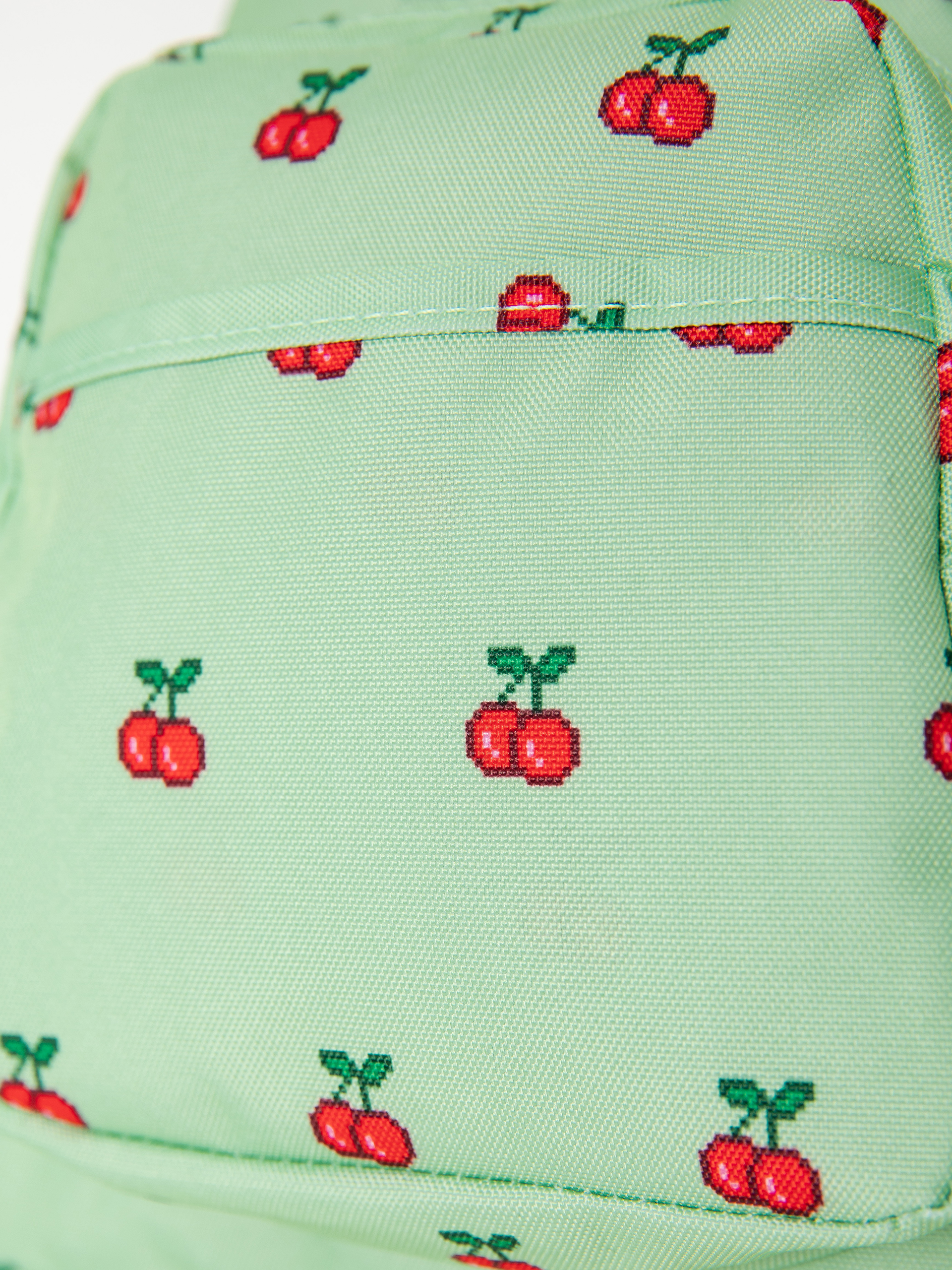 Batoh JanSport Half Pint (8 bit cherries)