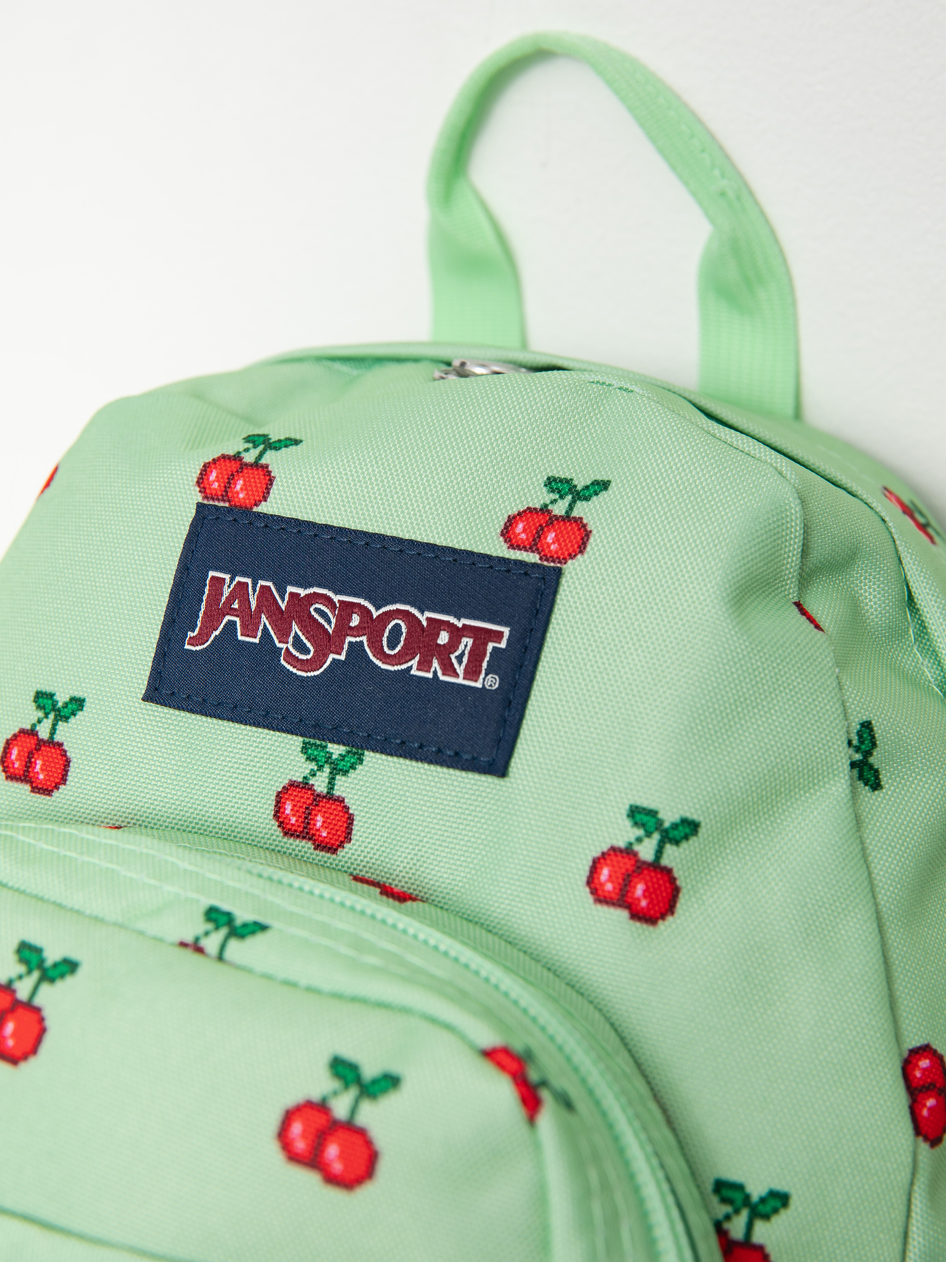 Batoh JanSport Half Pint (8 bit cherries)
