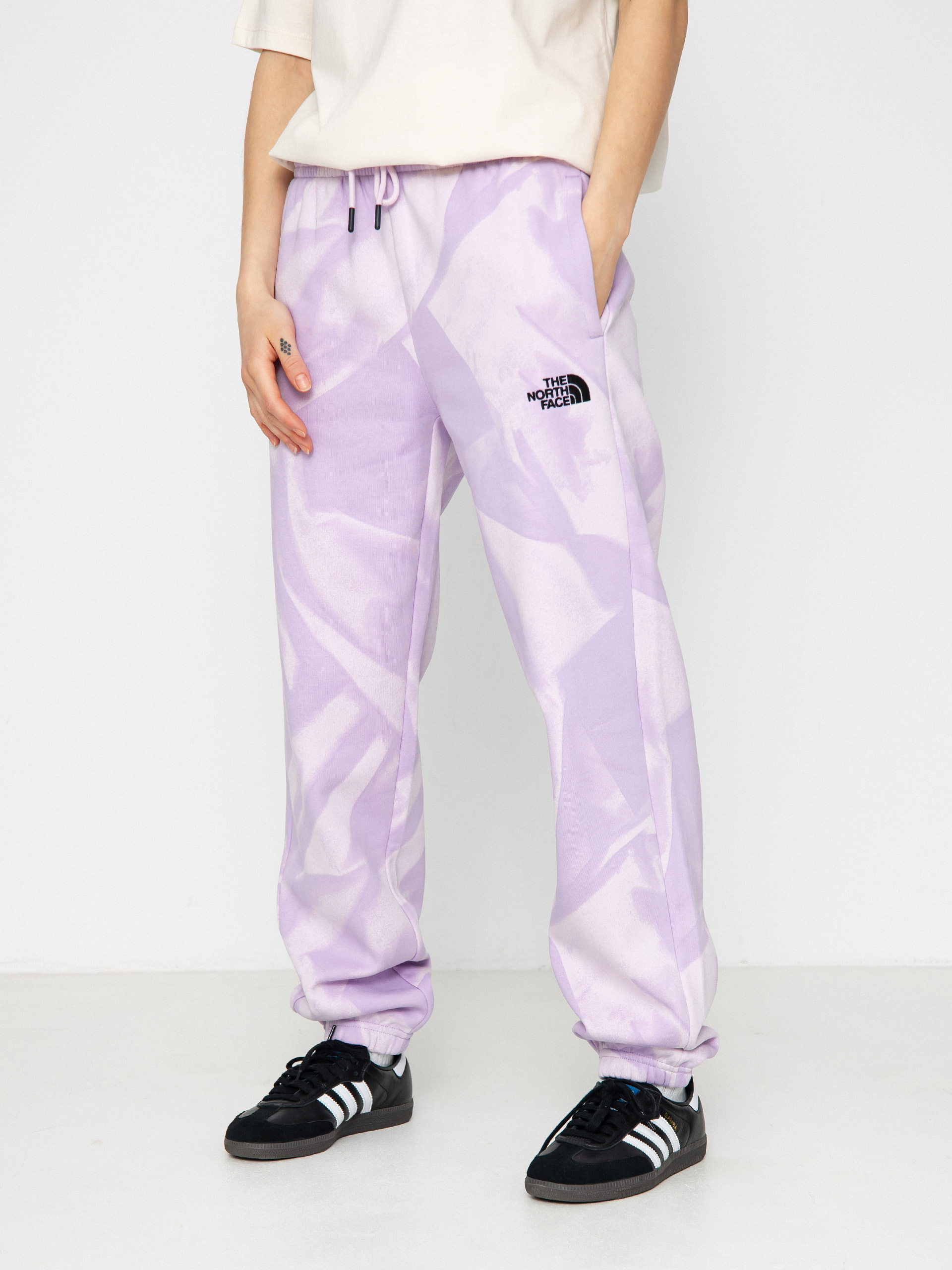 Nohavice The North Face Essential Jogger Print Wmn (icy lilac garment fold)