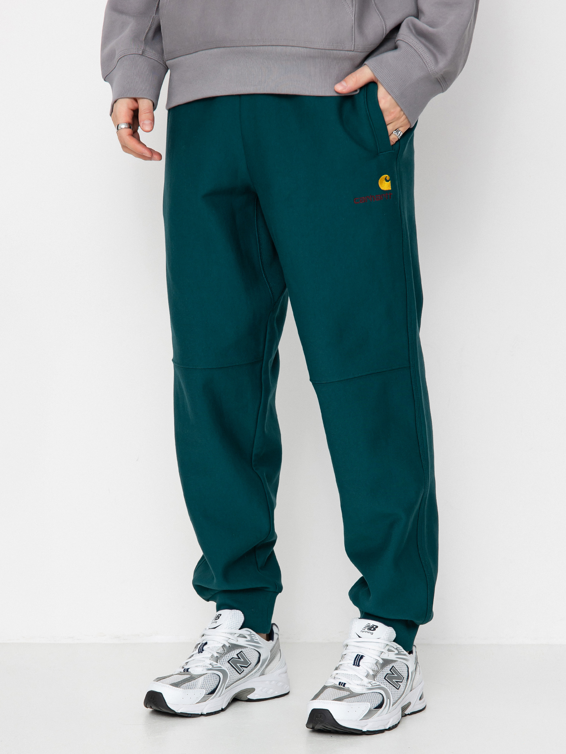 Nohavice Carhartt WIP American Script Jogging (malachite)