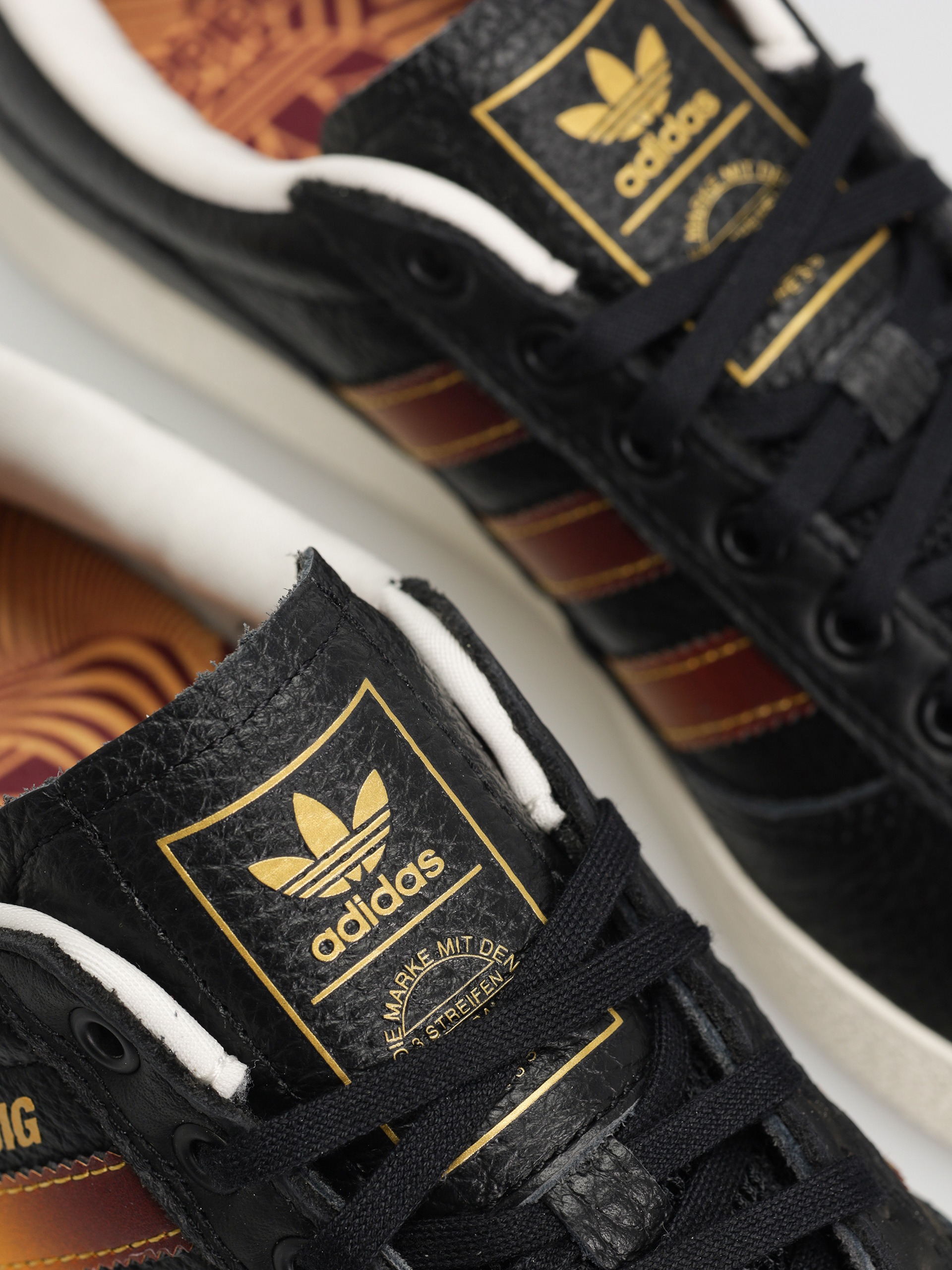 Topánky adidas Puig Indoor (cblack/shared/creyel)