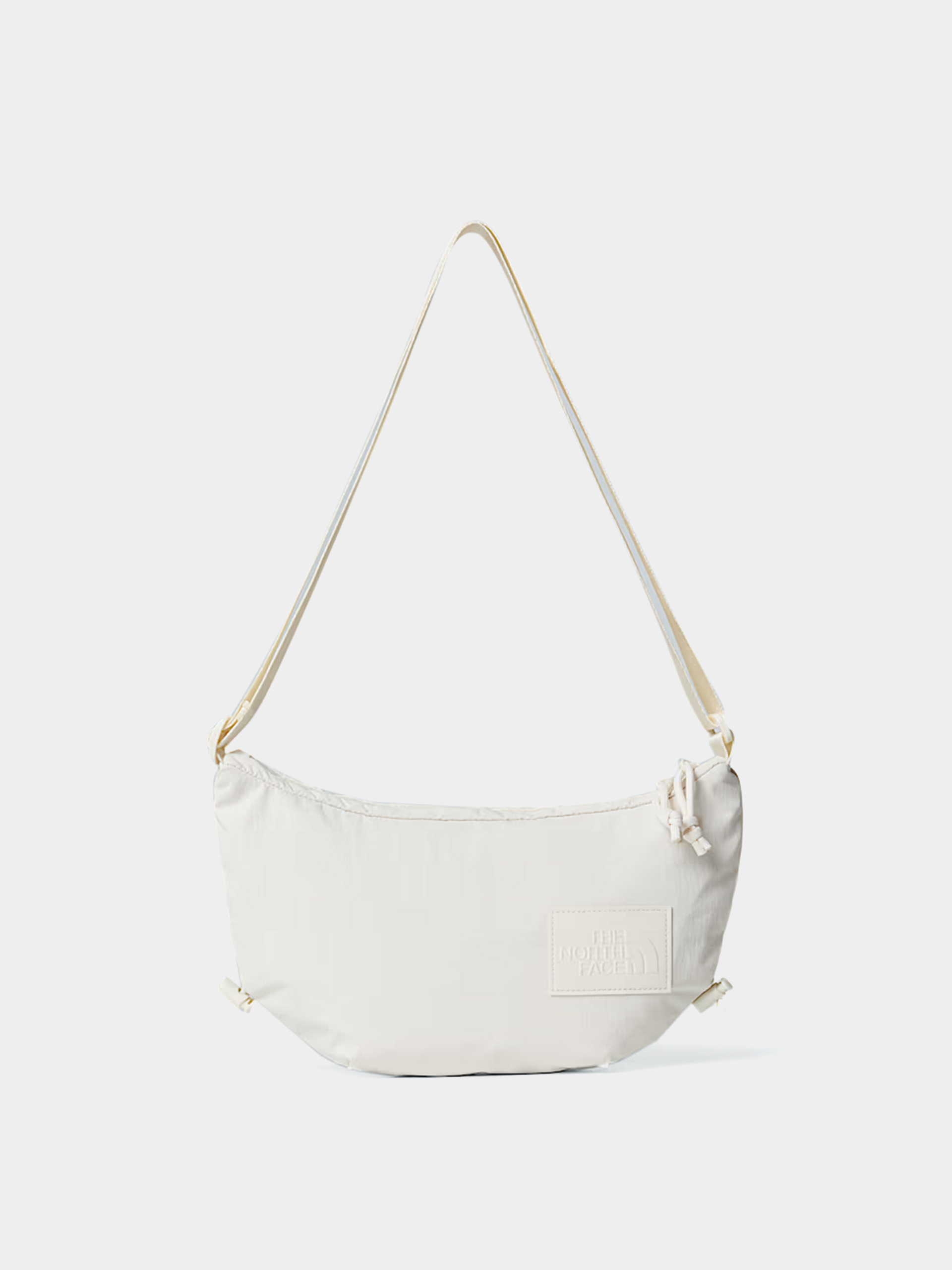 Kabelka The North Face Never Stop Crossbody Wmn (white dune)