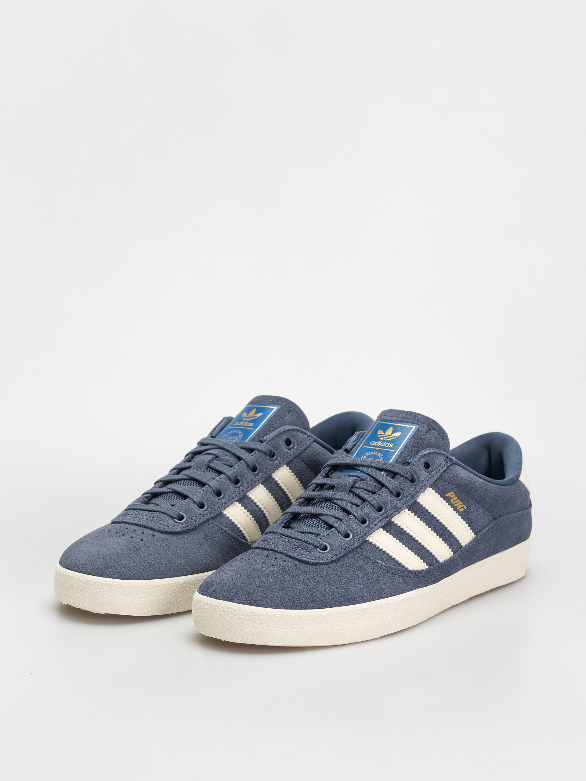 Topánky adidas Puig Indoor (prloin/owhite/blubir)