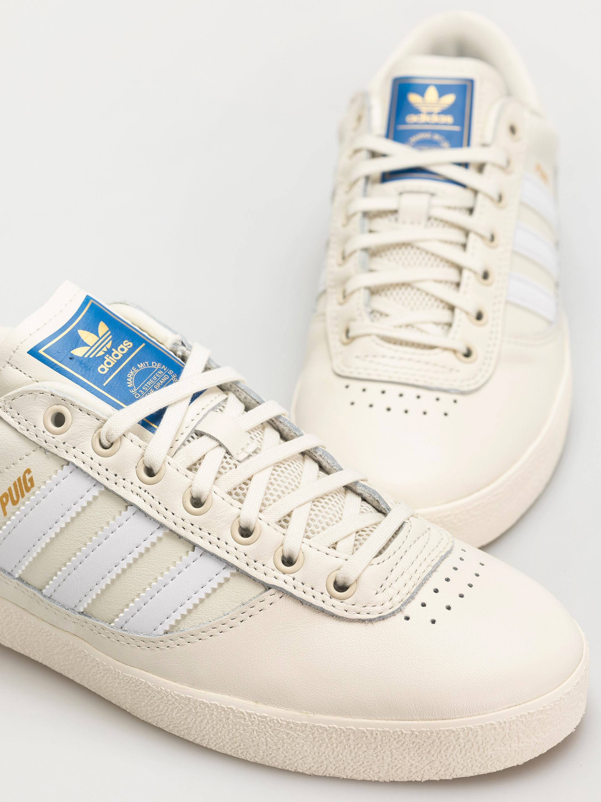 Topánky adidas Puig Indoor (owhite/ftwwht/blubir)