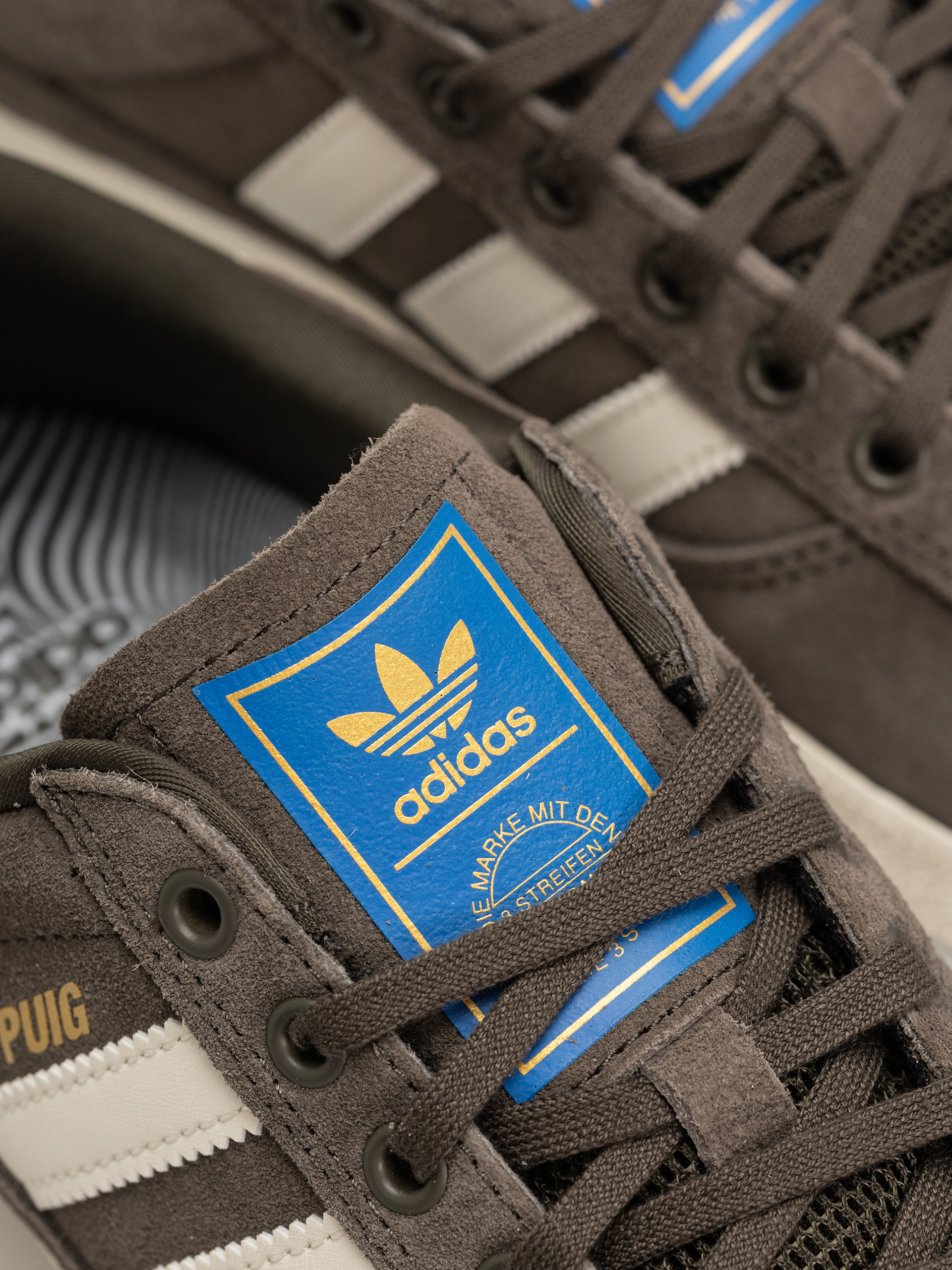 Topánky adidas Puig Indoor (shaoli/owhite/blubir)