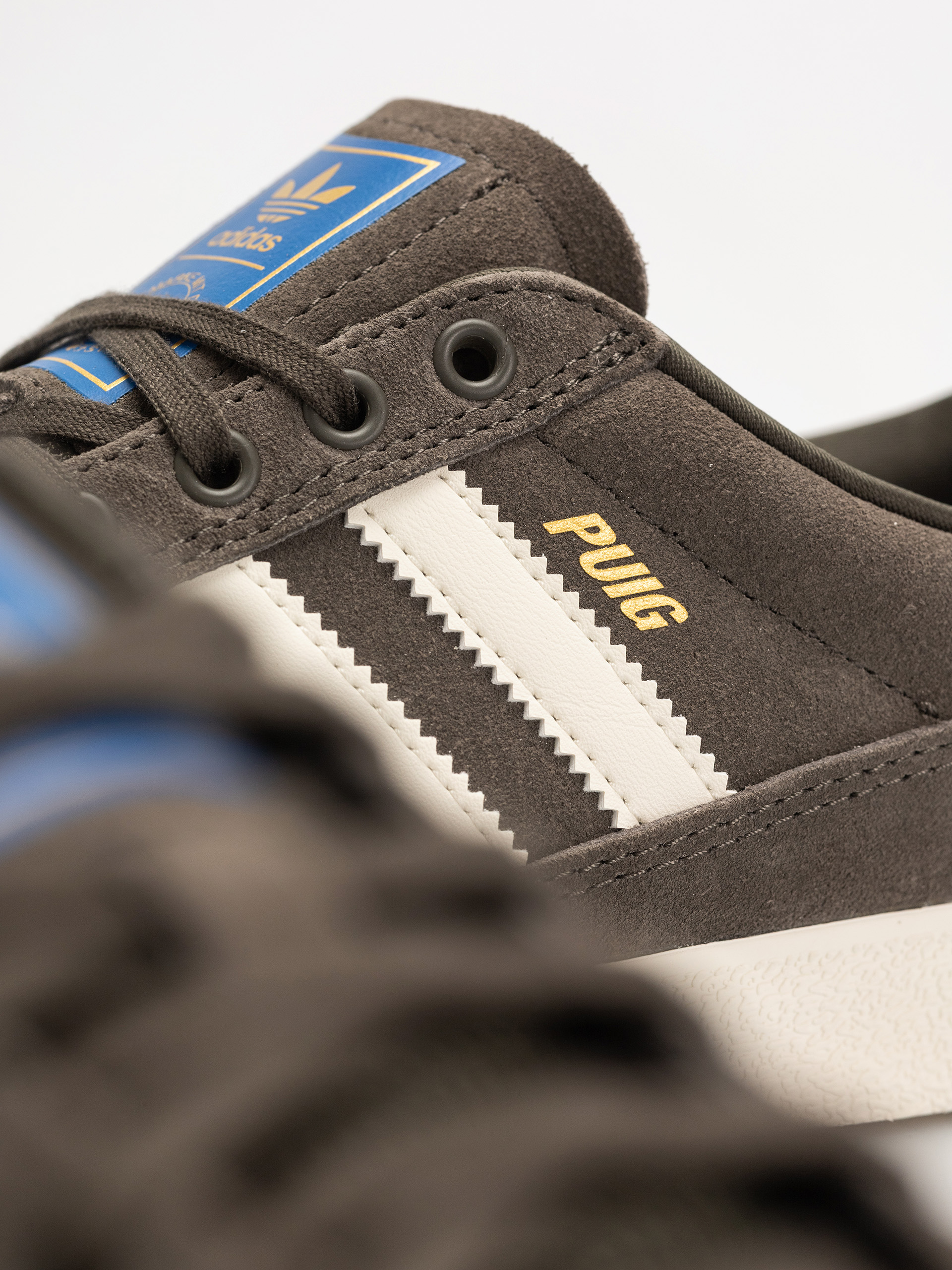 Topánky adidas Puig Indoor (shaoli/owhite/blubir)