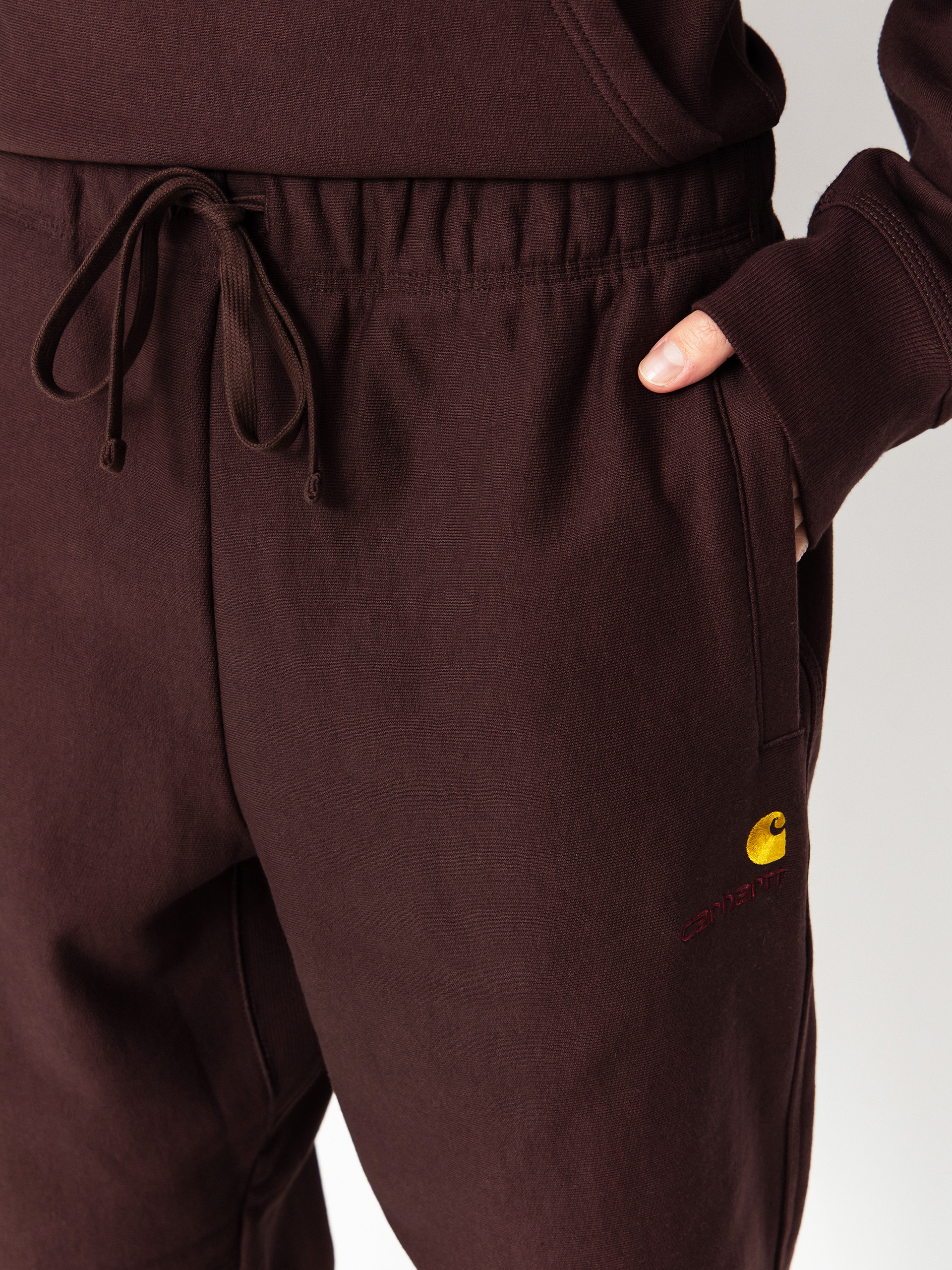 Nohavice Carhartt WIP American Script Jogging (palisander)