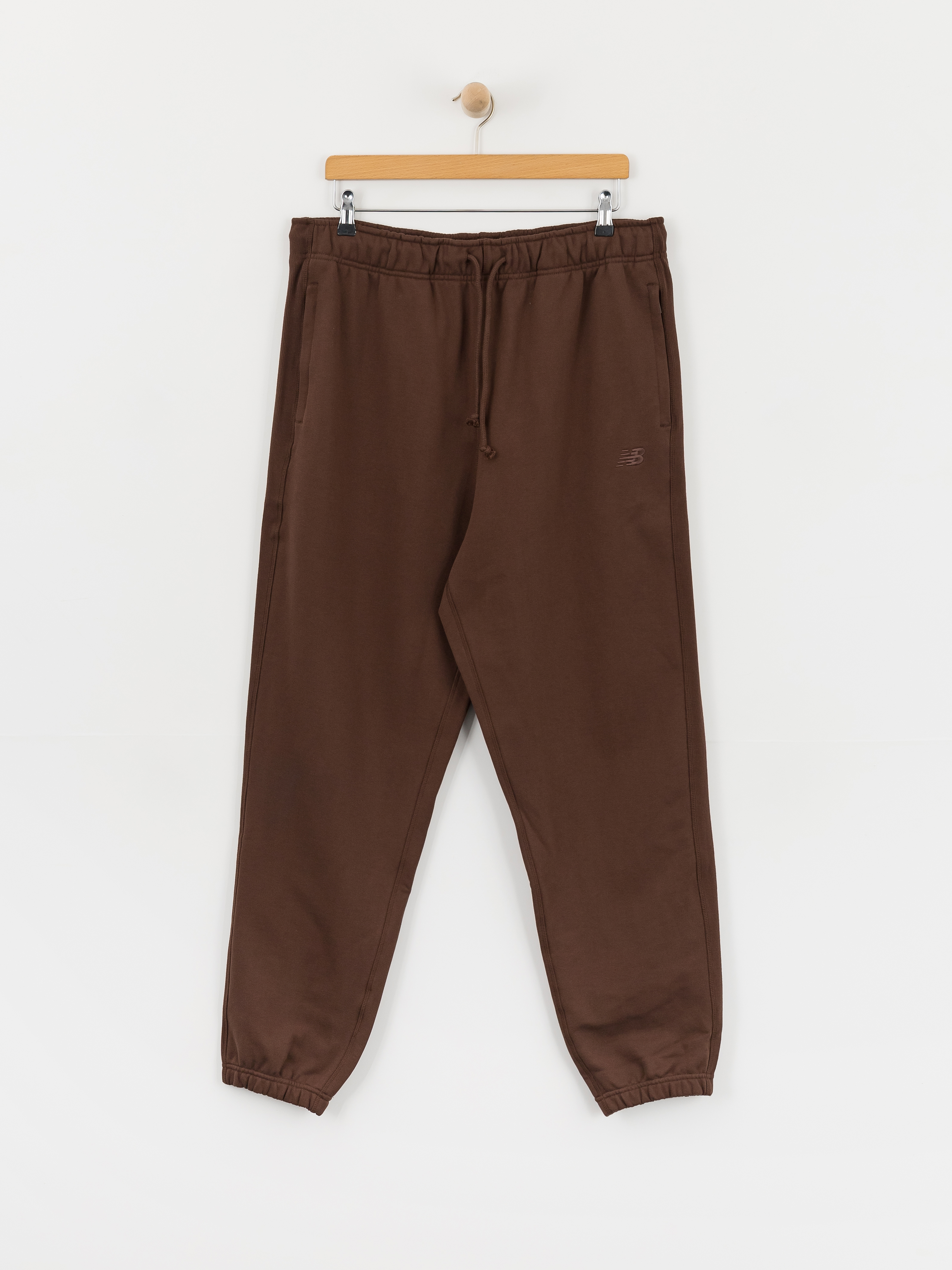 Nohavice New Balance Athletics French Terry Jogger (pumpernickel)