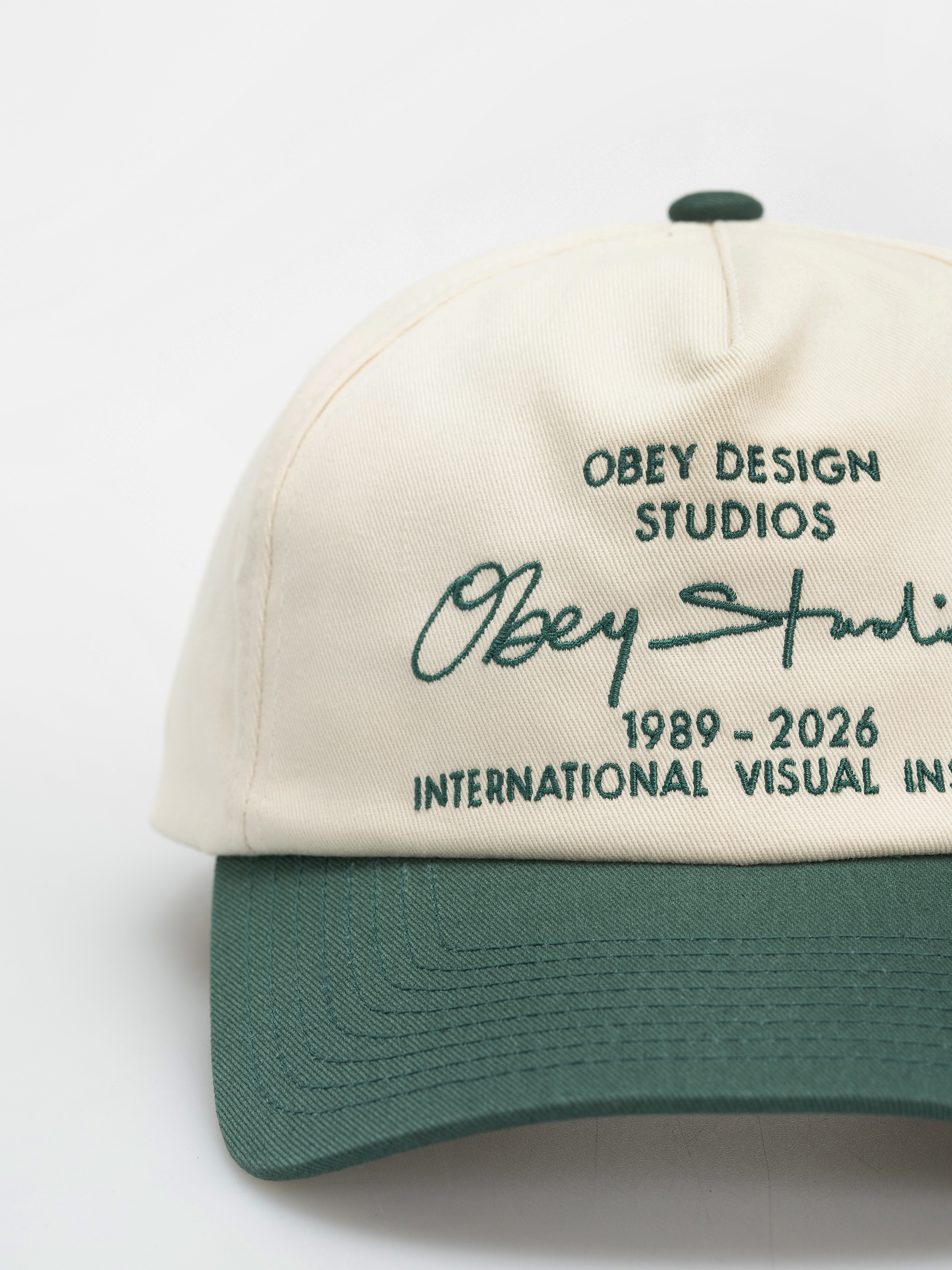 Šiltovka OBEY Design Studios 5 Panel (spruce multi)