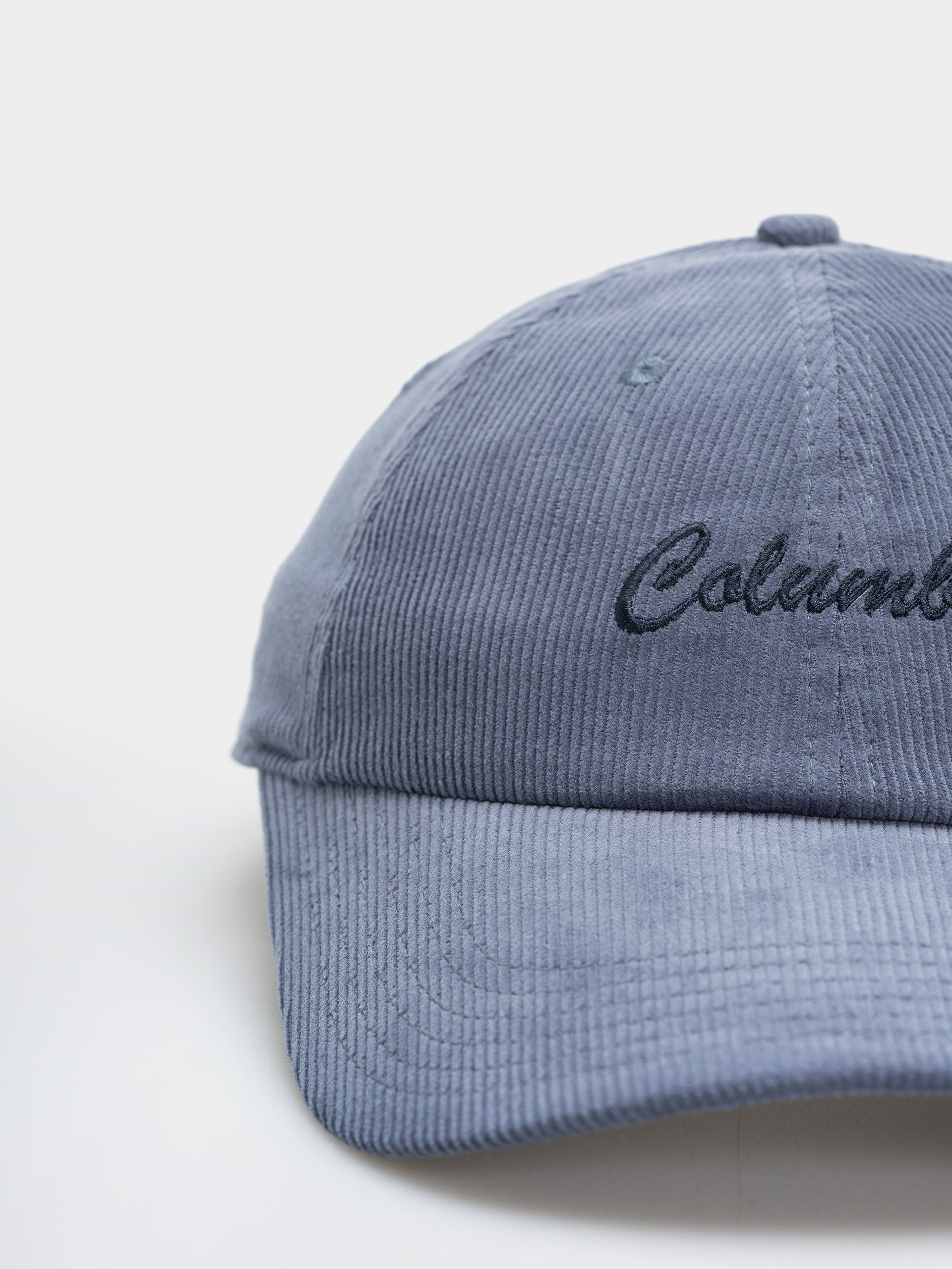 Šiltovka Columbia Wellzy Ball (dark mountain/columbia script)