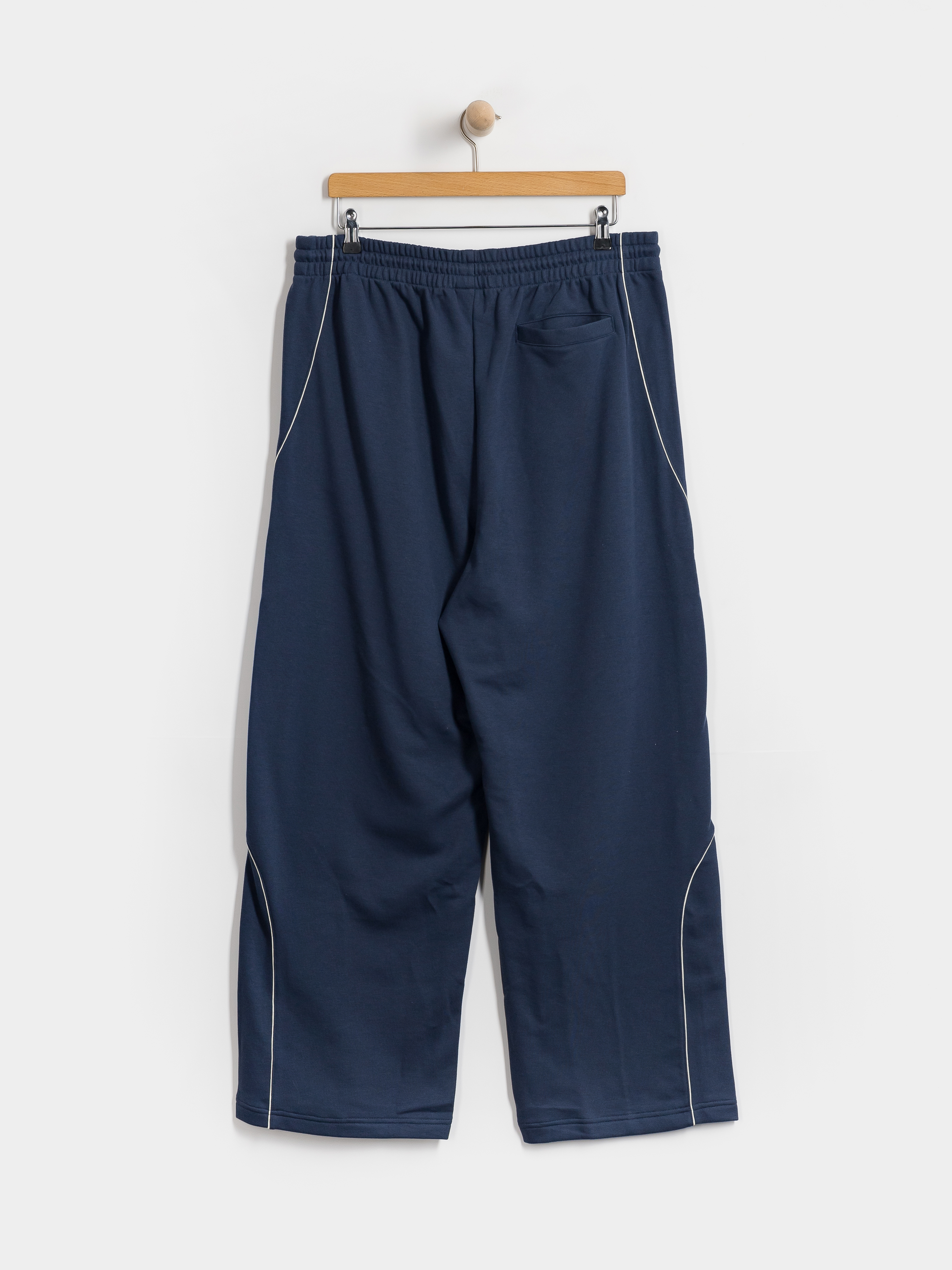 Nohavice New Balance Trackside French Terry (navy)
