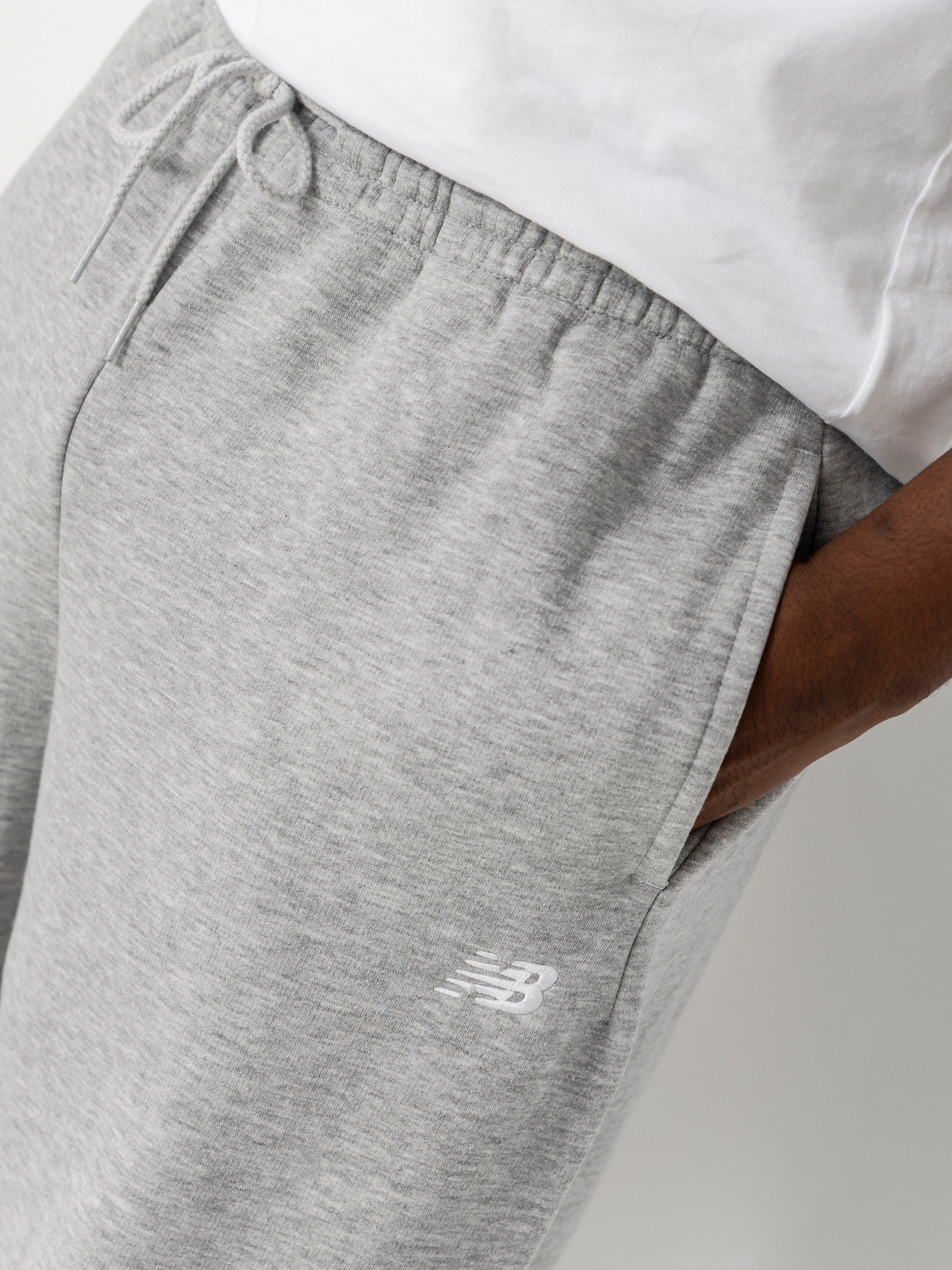 Nohavice New Balance Sport Essentials Fleece (athletic grey)