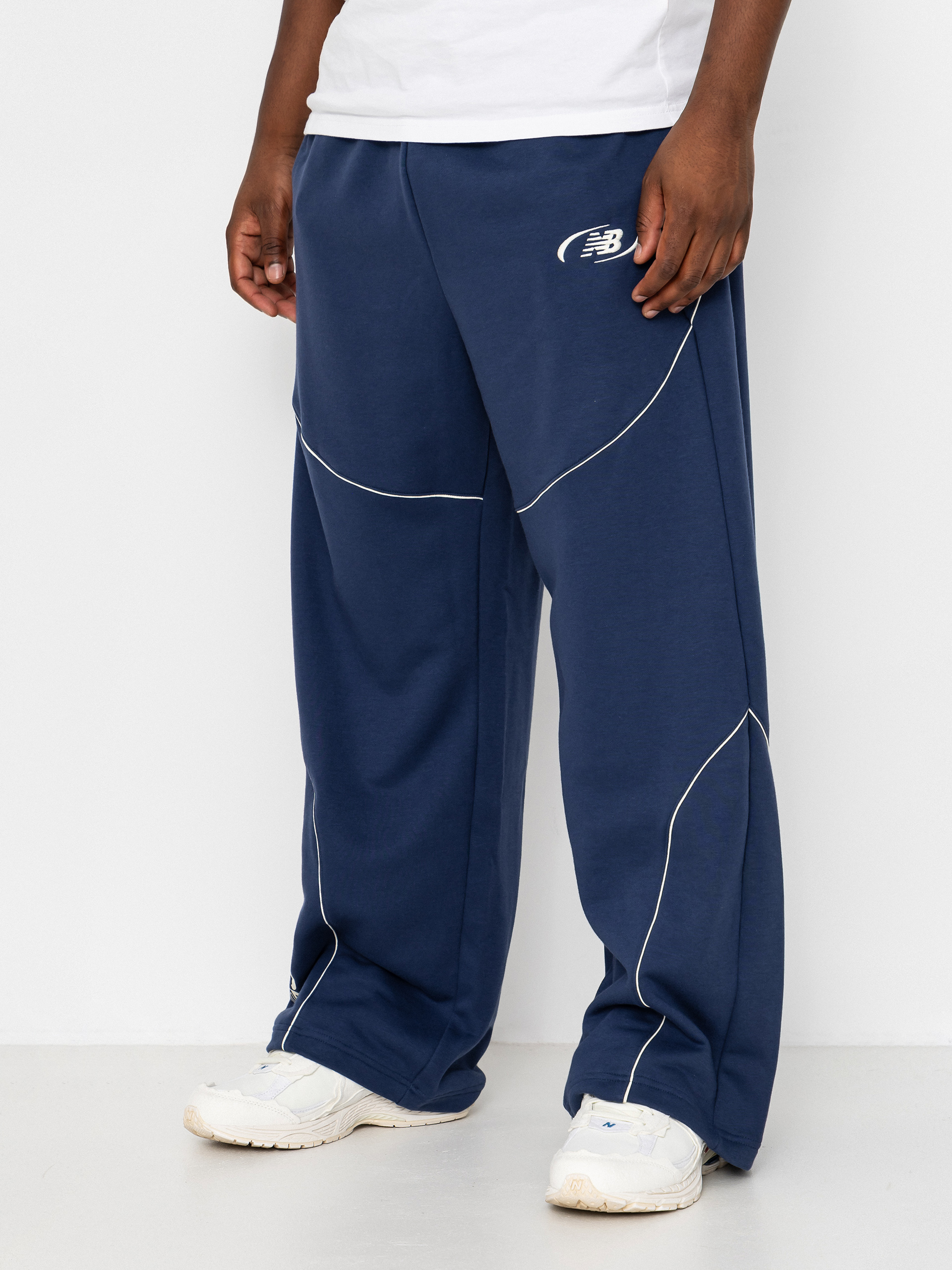 Nohavice New Balance Trackside French Terry (navy)