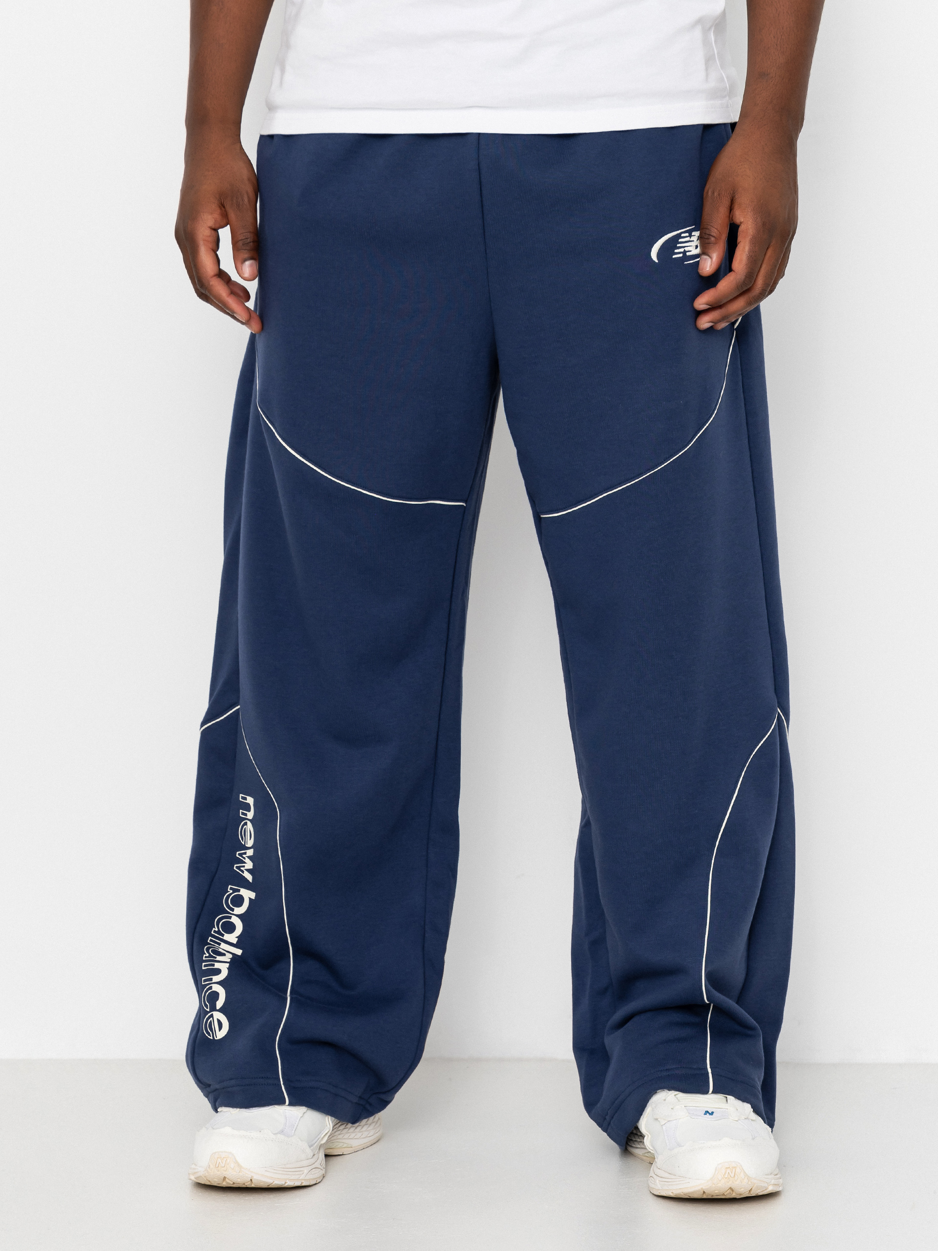 Nohavice New Balance Trackside French Terry (navy)