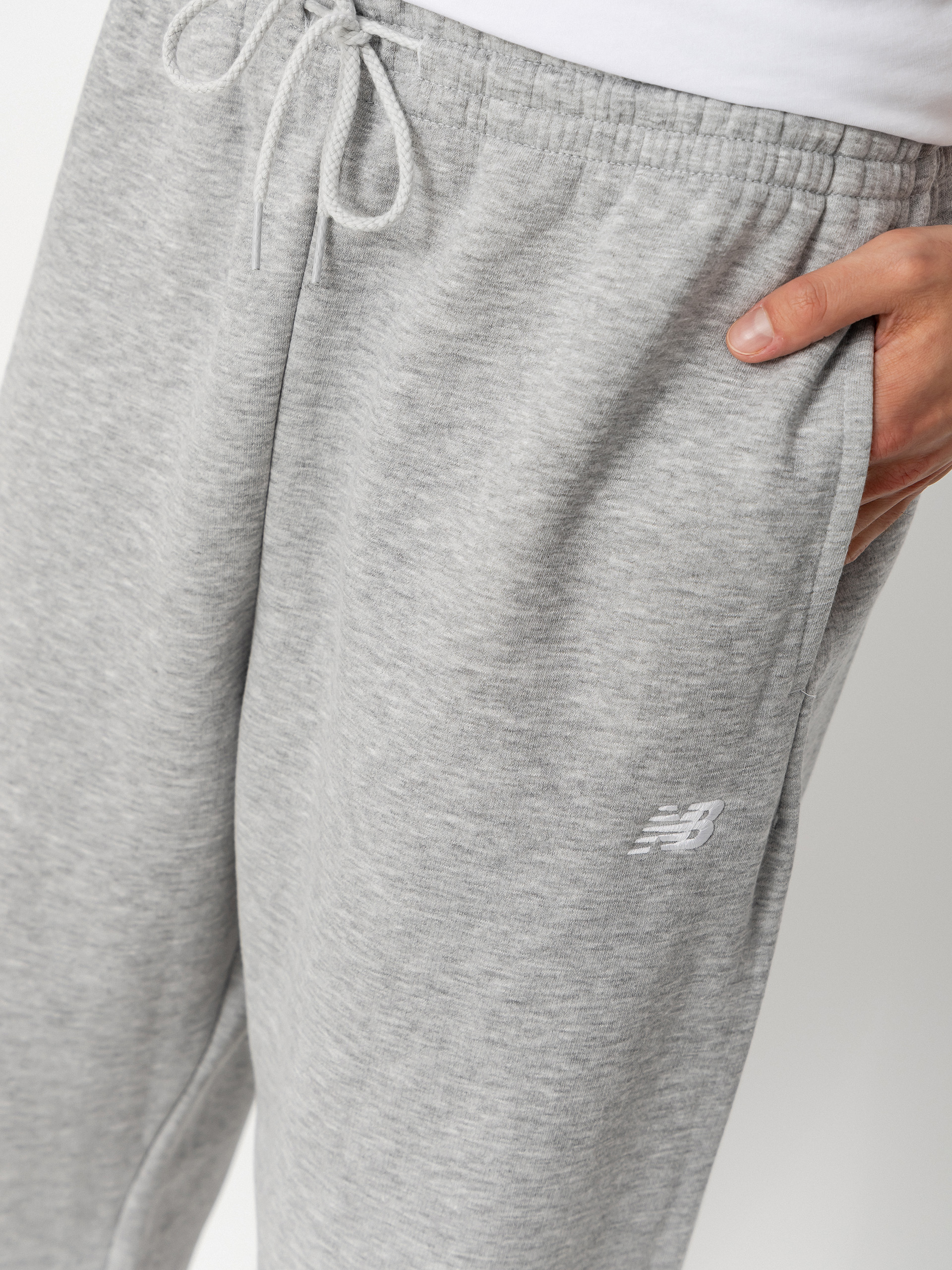 Nohavice New Balance Sport Essentials Fleece Jogger (athletic grey)