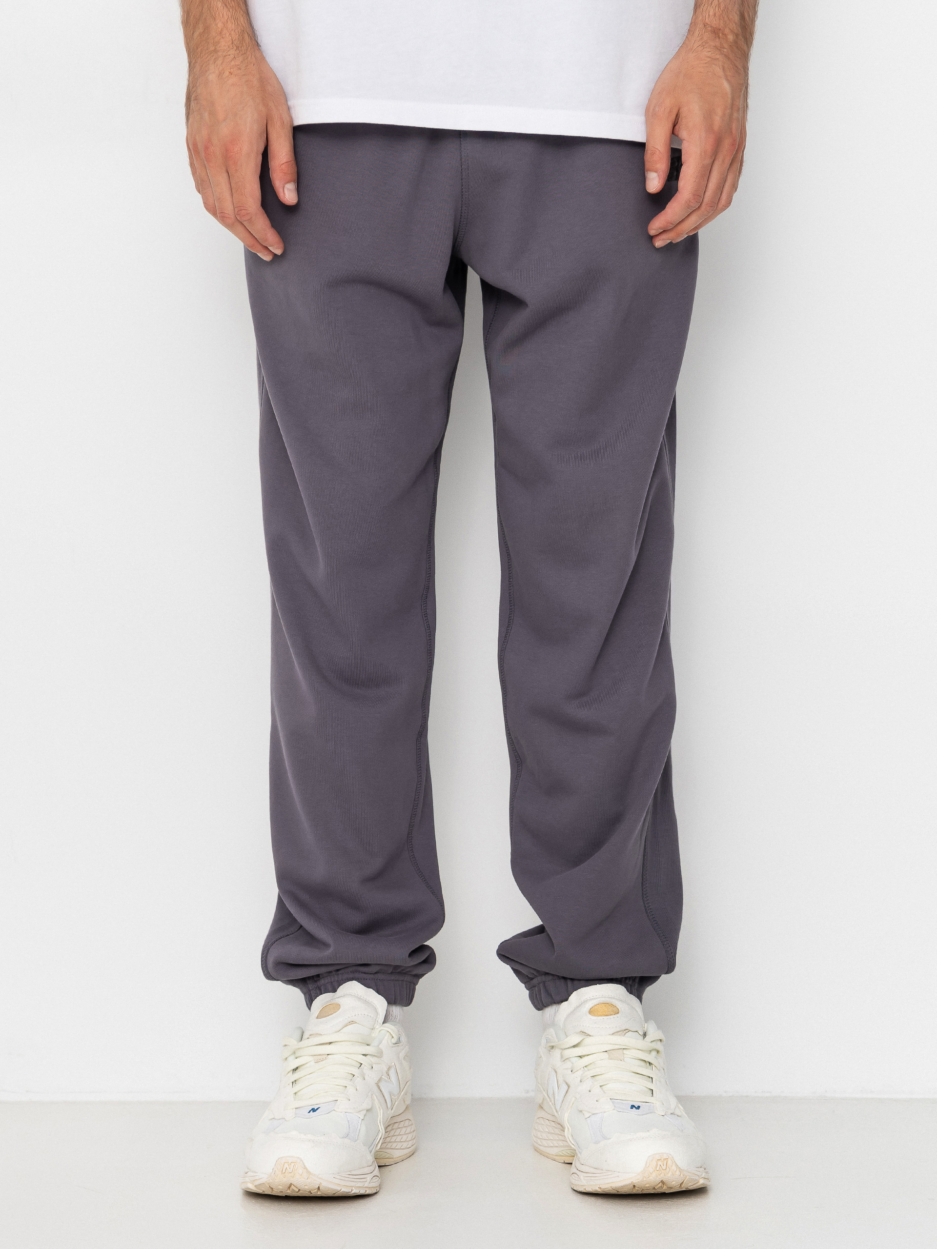 Nohavice New Balance Athletics French Terry Jogger