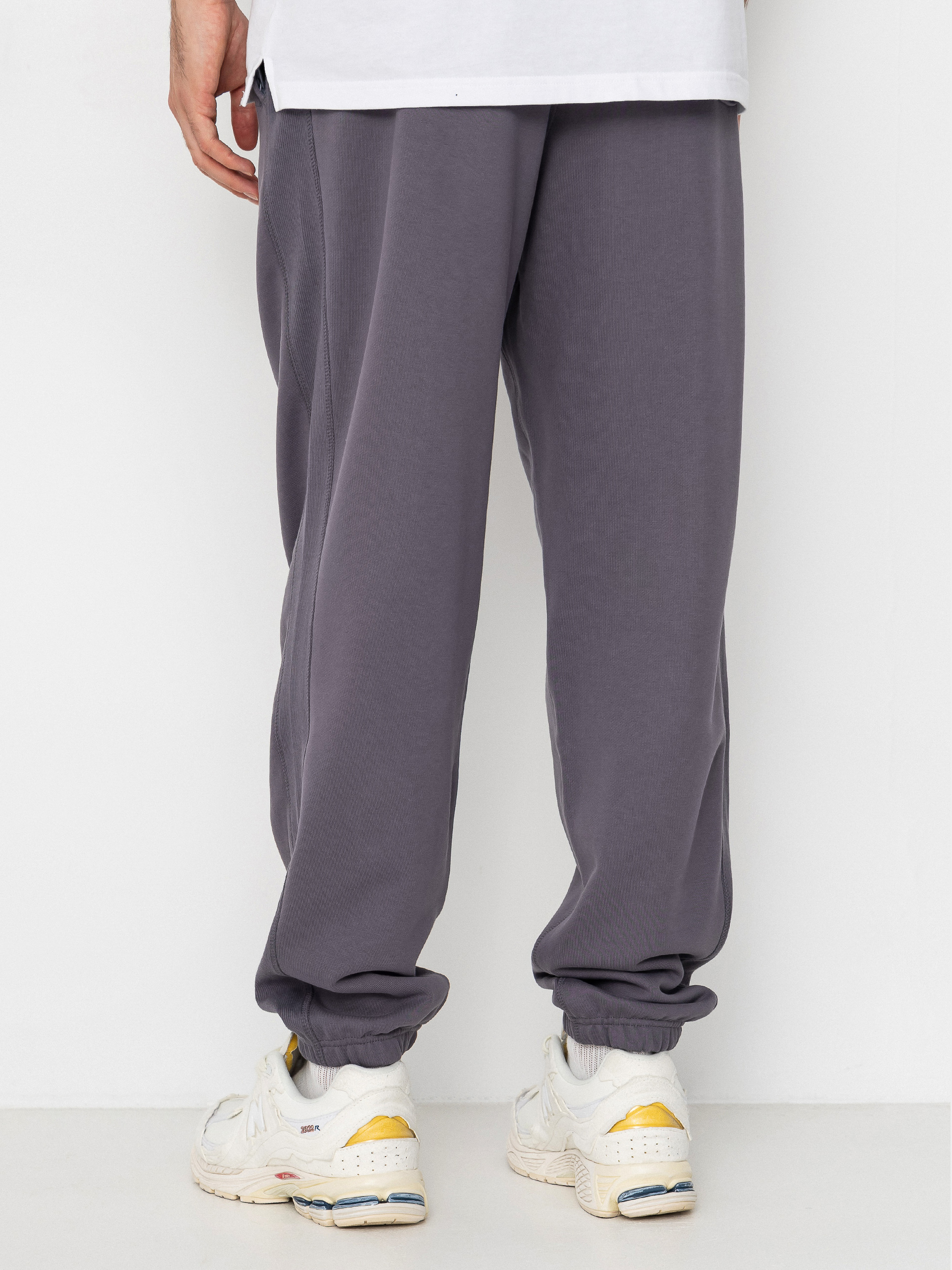 Nohavice New Balance Athletics French Terry Jogger (neptune grey)