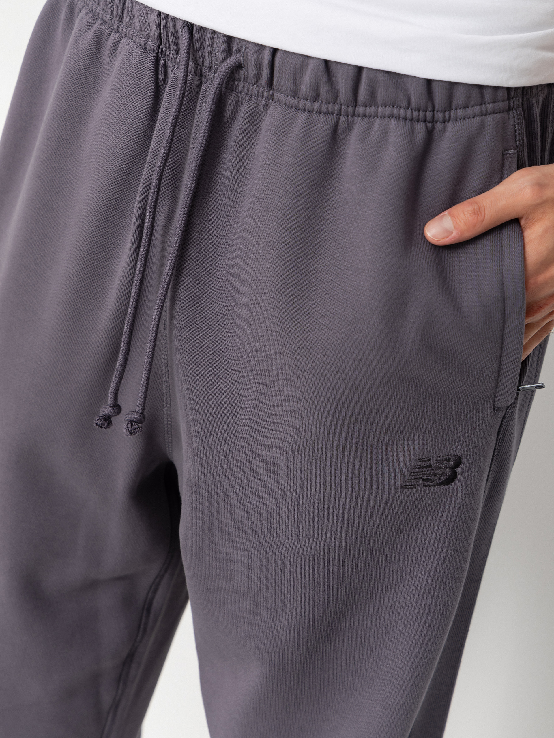 Nohavice New Balance Athletics French Terry Jogger (neptune grey)