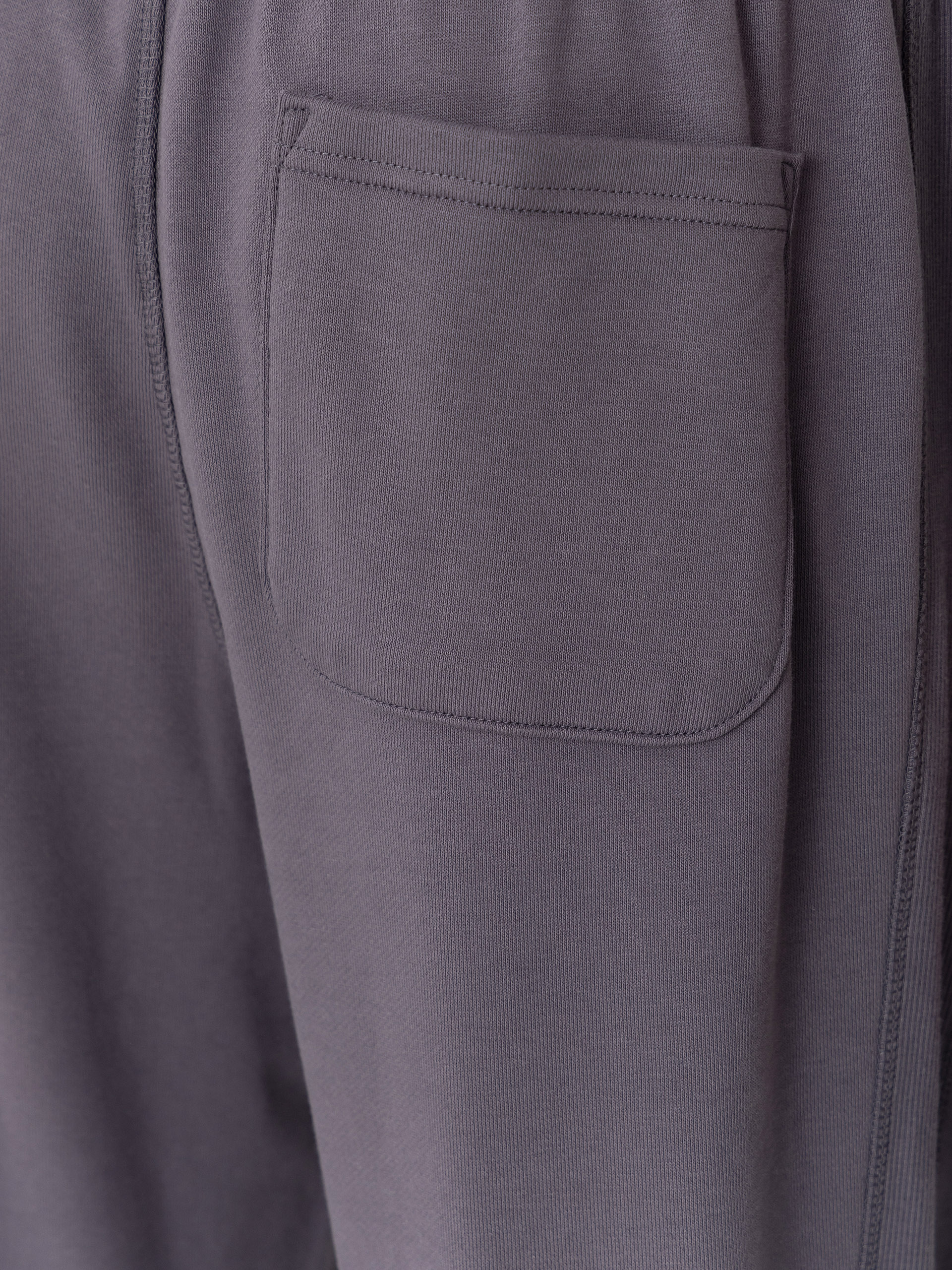 Nohavice New Balance Athletics French Terry Jogger (neptune grey)
